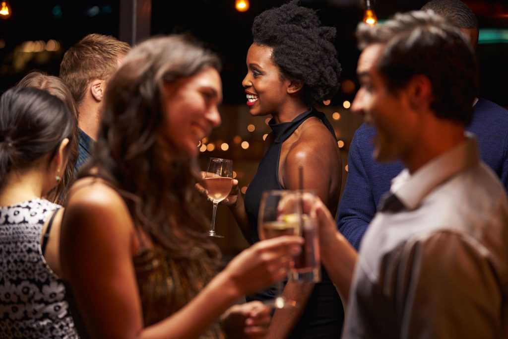 Niche 905's party room with couples socializing